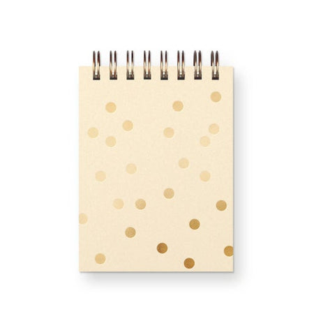 Notebook with gold polka dot pattern on a white background. Gold coil binding across the top.