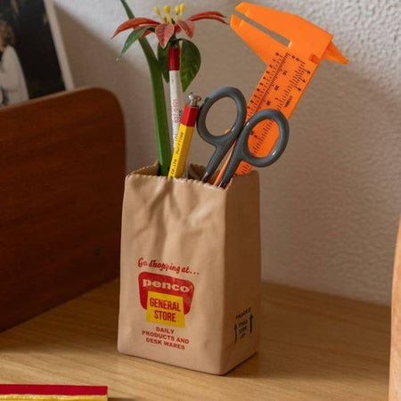 Vintage-style brown bag with 'Penco General Store' branding.