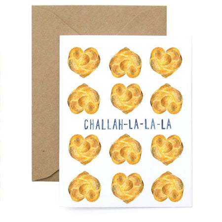 White card with images of challah bread shaped like hearts. Blue text saying, “Challah-La-La-La”. A brown kraft envelope is included.