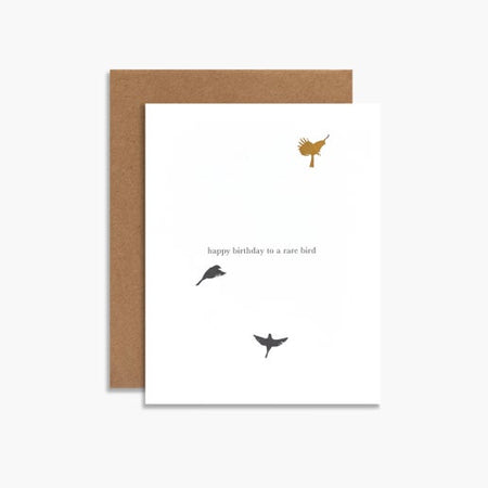 White card with gold foil text saying, “Happy birthday to a rare bird”. Images of three birds on card.  A brown kraft envelope is included.