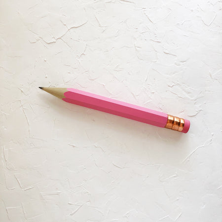 Pencil with pink body and copper top eraser.
