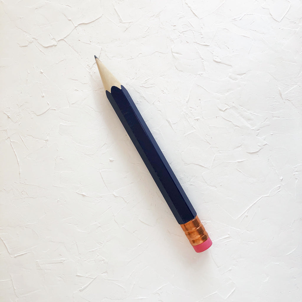 Pencil with blue navy body and copper top eraser.
