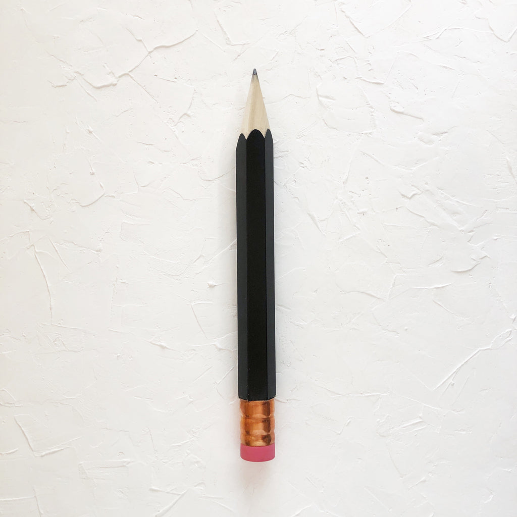 Pencil with black body and copper top eraser.