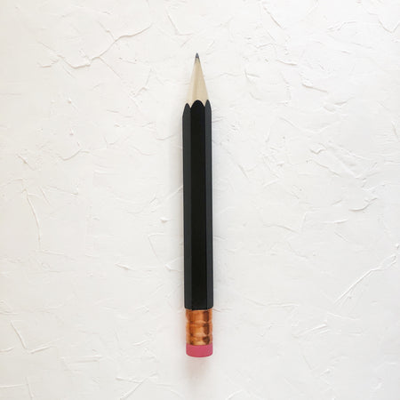 Pencil with black body and copper top eraser.