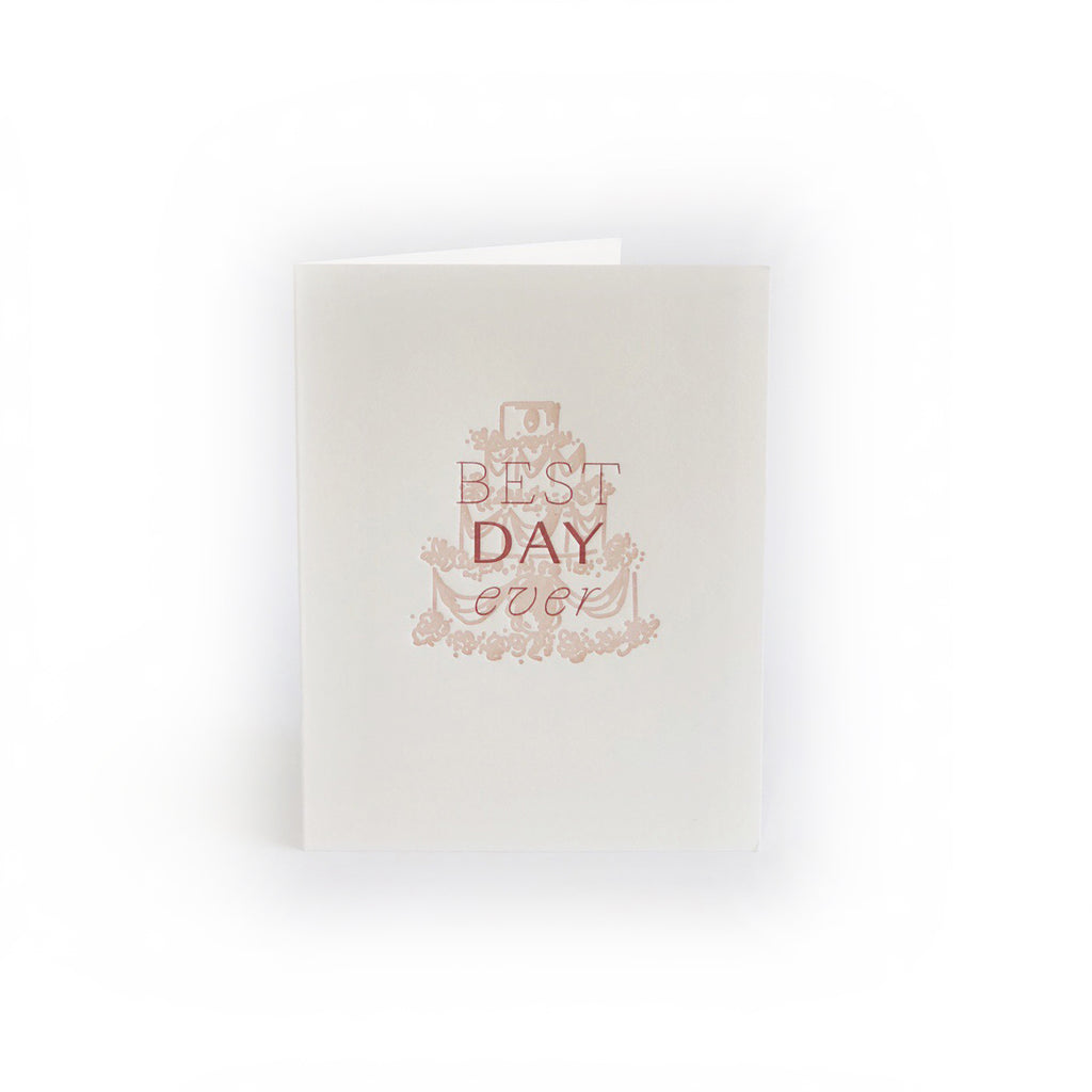 White card with red text saying, “Best Day Ever”. Images of a red outlined 3 tier wedding cake. An envelope is included.