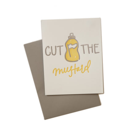 Ivory card with gray and yellow text saying, “Cut the Mustard”. Image of a yellow mustard bottle in center of card. A gray envelope is included.