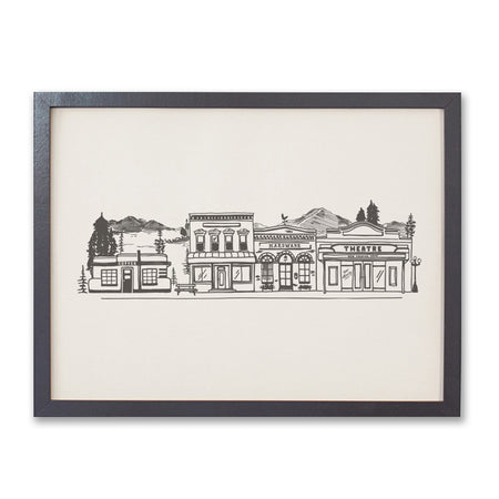 Print with ivory background and black ink. Images of a mountain town with mountains; evergreen trees; town buildings such as coffee shop, hardware store, bank and theatre.