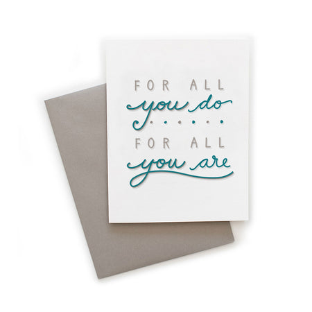 White card with gray and aqua text saying, “For All You Do For All You Are”. A gray envelope is included.