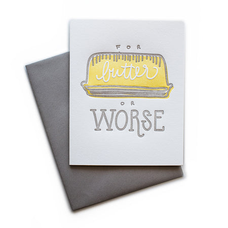 White card with gray and yellow text saying, “For Butter Or Worse”. Image of a yellow butter dish. A gray envelope is included.