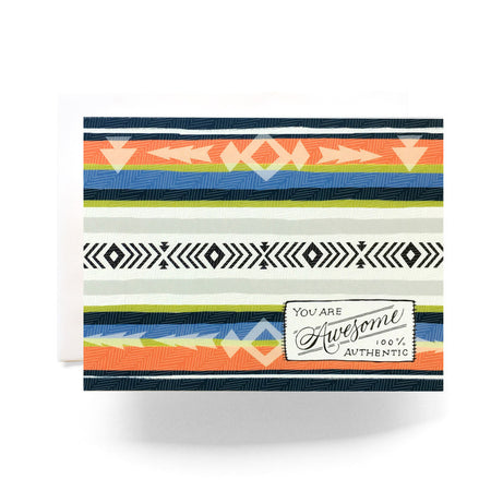 White card with images of a camp blanket in the colors of black, white, gray, blue, green and orange. Black text saying, “You Are Awesome 100% Authentic”. A white envelope is included. 