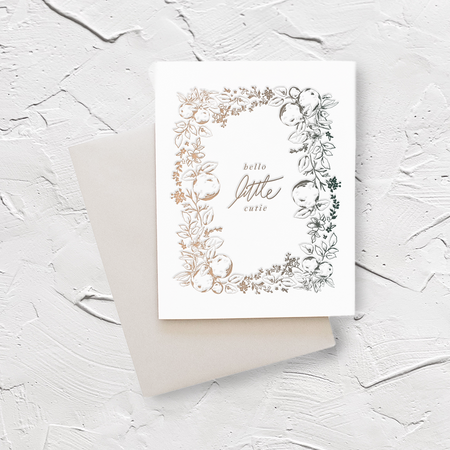 White card with green text saying, “Hello Little Cutie”. Images of fruit vines with pears and leaves. A gray envelope is included.
