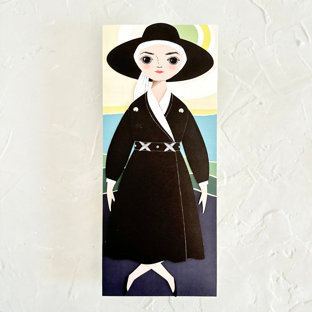 Card with blue, black, yellow and green modern design background with image of a woman wearing a black and white dress and a black wide brimmed hat. 
