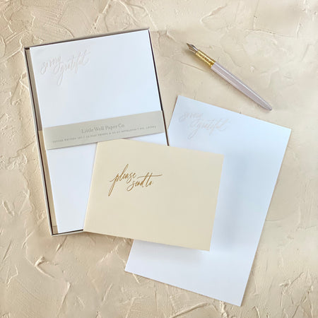White notepaper with gold muted text saying, “So very grateful” in top left corner. Matching off white envelopes included.