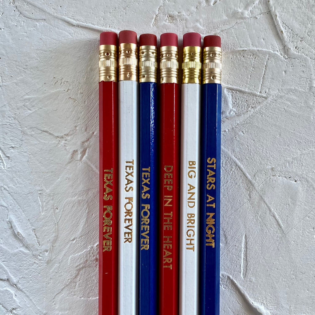 Set of pencils in red, white and blue with gold text saying, “Texas Forever”; “Deep in the Heart”; “Big and Bright”; and “Stars At Night”. 