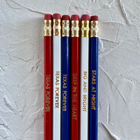 Set of pencils in red, white and blue with gold text saying, “Texas Forever”; “Deep in the Heart”; “Big and Bright”; and “Stars At Night”. 