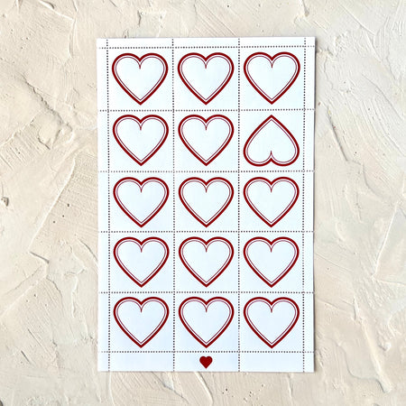 Sheet of stickers with red heart outlines.