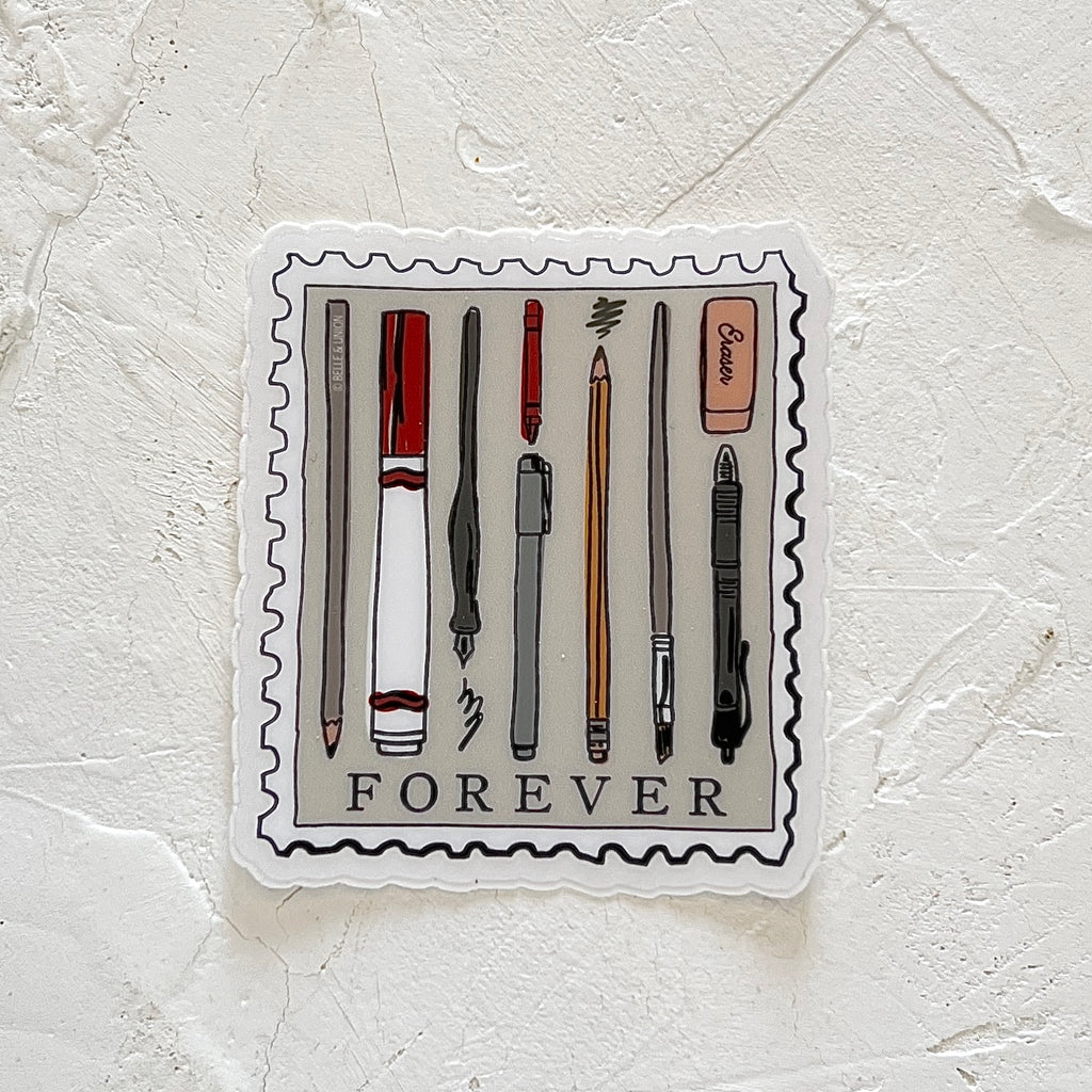 White sticker in the image of a postage stamp with images of various pens and pencils and pink eraser. Black text saying, “FOREVER” across the bottom.