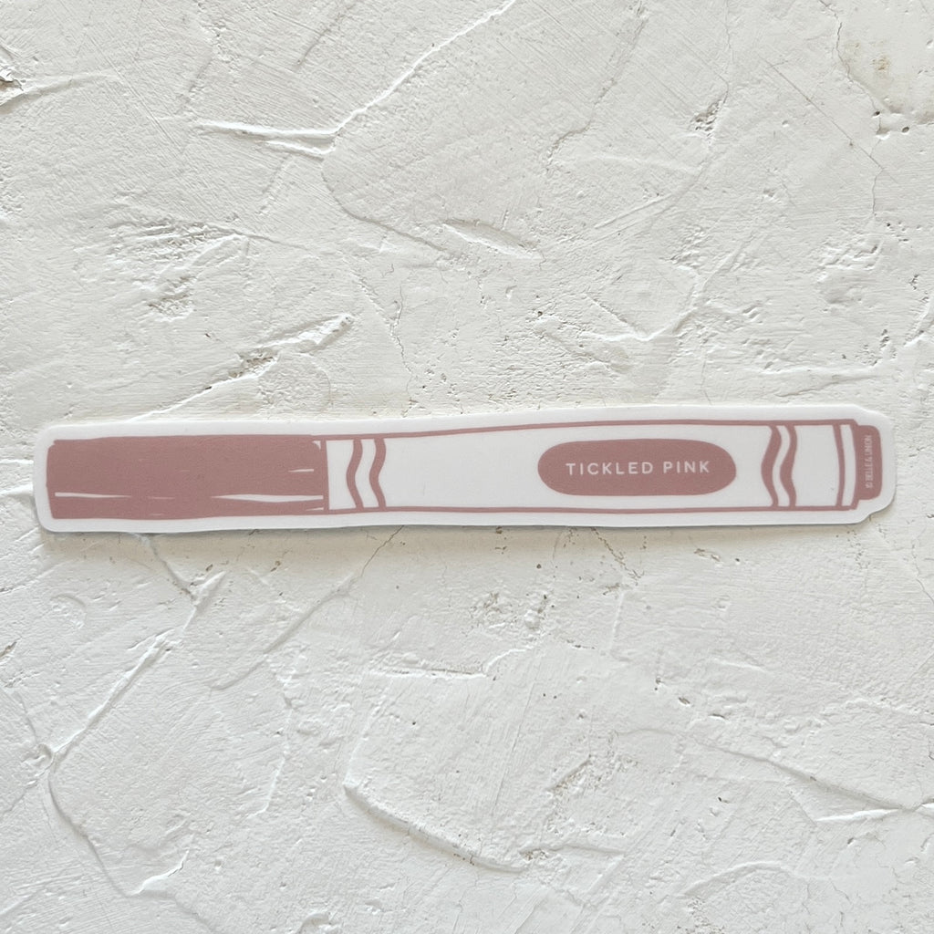 Rectangular white stickers in the image of a child’s marker with various pink cap and label with white text saying, “Tickled Pink”.