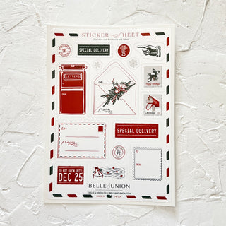 Package of snail mail gift stickers including: Christmas Day delivery; Special Delivery; Do Not Open Until Dec 25; Happy Holidays postage stamp; red mailbox postage stamp; red mailbox; white traditional mailing envelope.