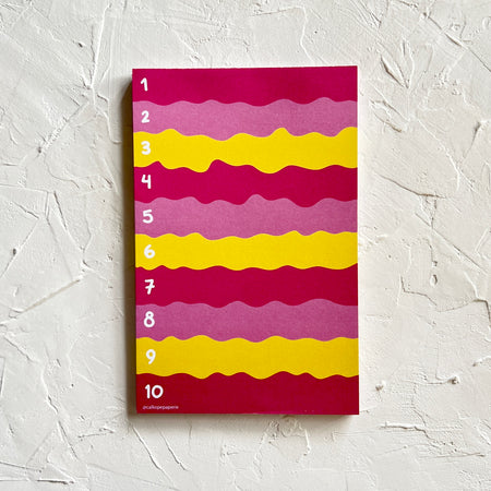 Notepad with red, pink and yellow wavy lines and white text numbers 1-10 down left side.