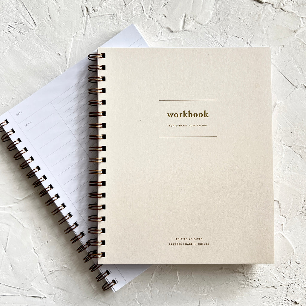 Ivory cover with gold foil text saying, “Workbook For Dynamic Notetaking”.