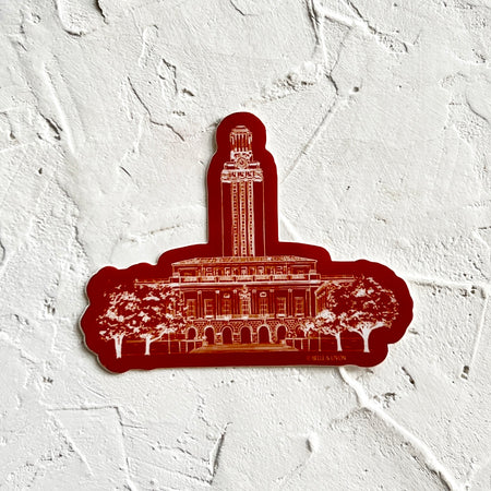 Burgundy sticker with image of iconic UT Tower building from the University of Texas.
