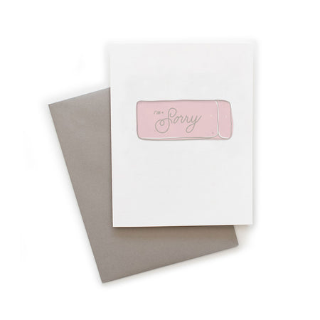 White card with gray text saying, “I’m Sorry”. Image of a classic pink school eraser. A gray envelope is included.