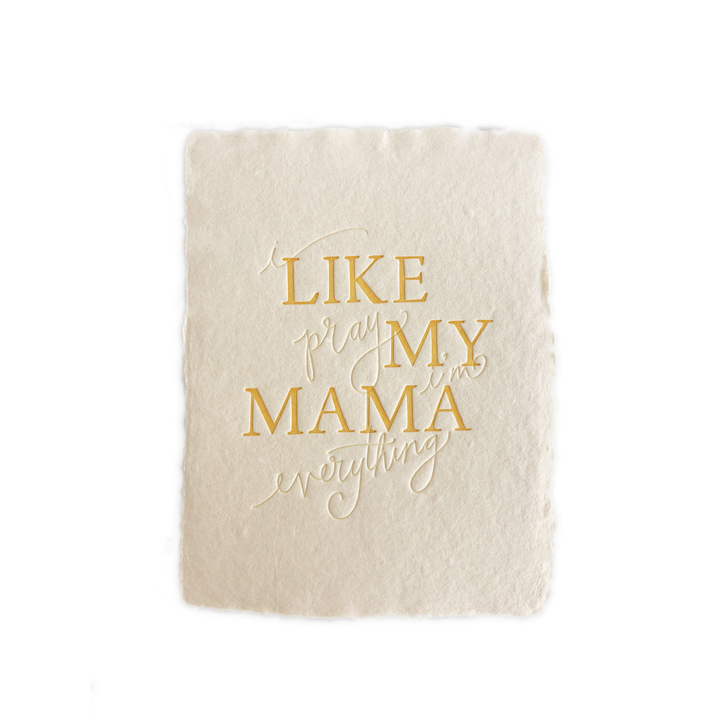 Ivory textured card with gold text saying, “I Pray I’m Everything Like My Mama”. A gray envelope is included.