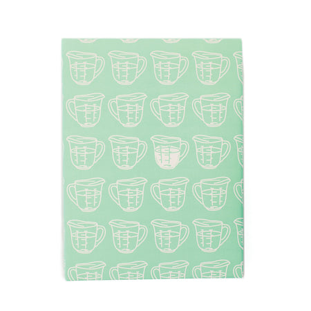 Light green background with image of white liquid measuring cups.