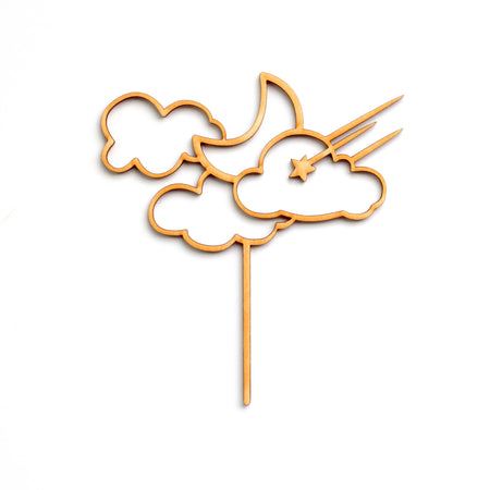 Wooden die cut cake topper in the image of clouds, moon and shooting star.