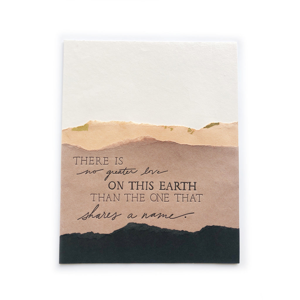Art print with ivory background with mountain scene with brown, tan and black mountains. Black text saying, “There is No Greater Love on this Earth Than the One that Shares a Name”.
