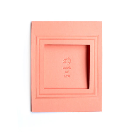 Rectangle pink card with arched photo cut out in center with text saying, “Work of Art” with an embossed image of a paint palette.  A matching envelope is included.