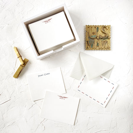 Set of ivory envelopes with 3 different designs: black text saying, “Post Card”; red text saying, “Mail