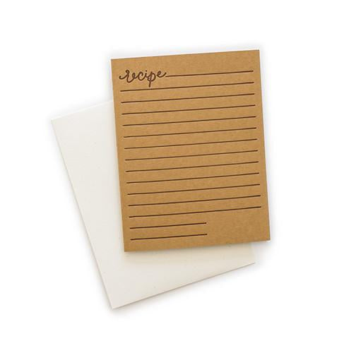 Brown card with black and brown text saying, “Recipe” with blank lines horizontally down the card. A white envelope is included.