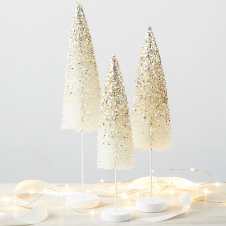 Decorative brush trees in white sparkle coloring with white stems.