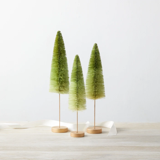 Decorative brush trees in green ombre coloring with brown stems.