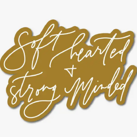 Brown sticker with white script text saying, “Soft Hearted and Strong Minded.”