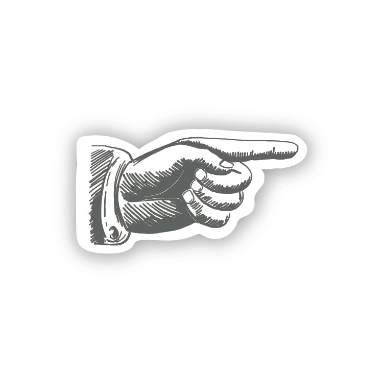 White sticker in the image of a gray pointed finger pointing to the right.