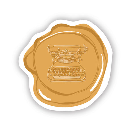 Gold circle sticker in the image of a gold wax envelope seal with an embossed typewriter image in center.
