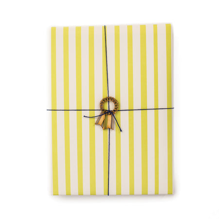 White gift wrap with yellow vertical stripes.