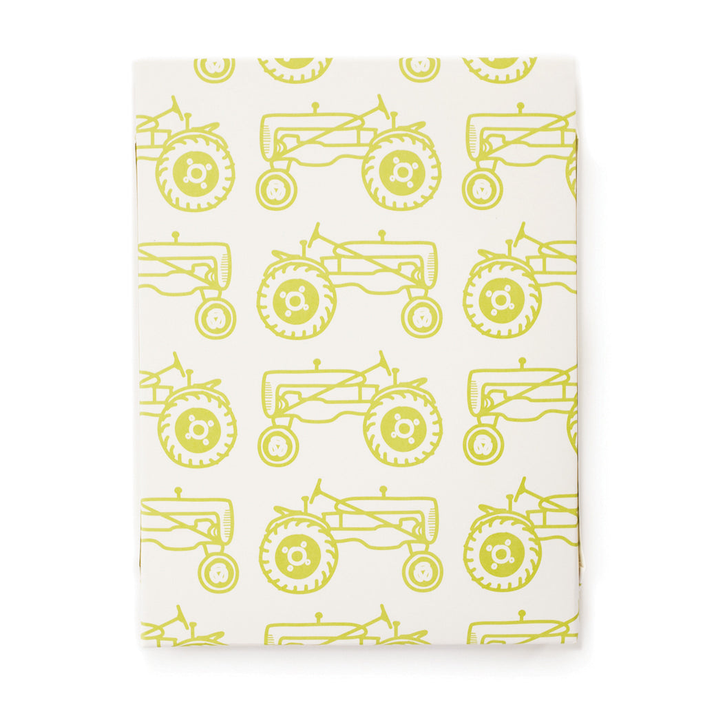 Ivory paper with tiled yellow tractors.