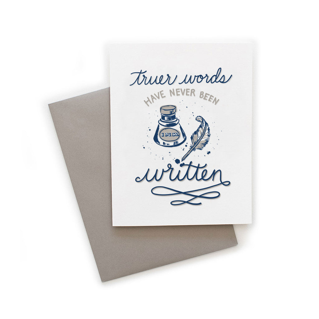 White card with gray and blue text saying, “Truer Words Have Never Been Written”. Images of a gray and blue inkwell and feather quill pen. A gray envelope is included.