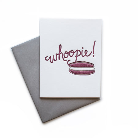 White card with burgundy text saying, “Whoopie!” Image of a burgundy and white whoopie pie. A gray envelope is included.