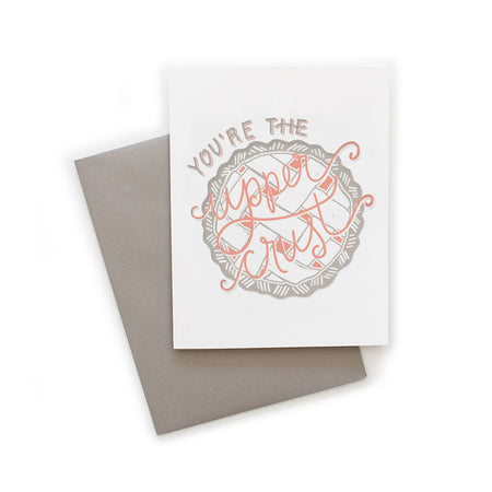 White card with gray and pink text saying, “You’re the Upper Crust”. Image of a gray and pink pie with lattice crust on top. A gray envelope is included.