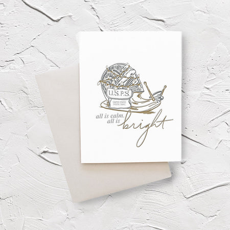 White card with silver and gold text saying, “All is Calm. All is Bright.” Image of a snail dressed as a postal carrier with a USPS label, standing for United States Postal Snail, on the side. A gray envelope is included.