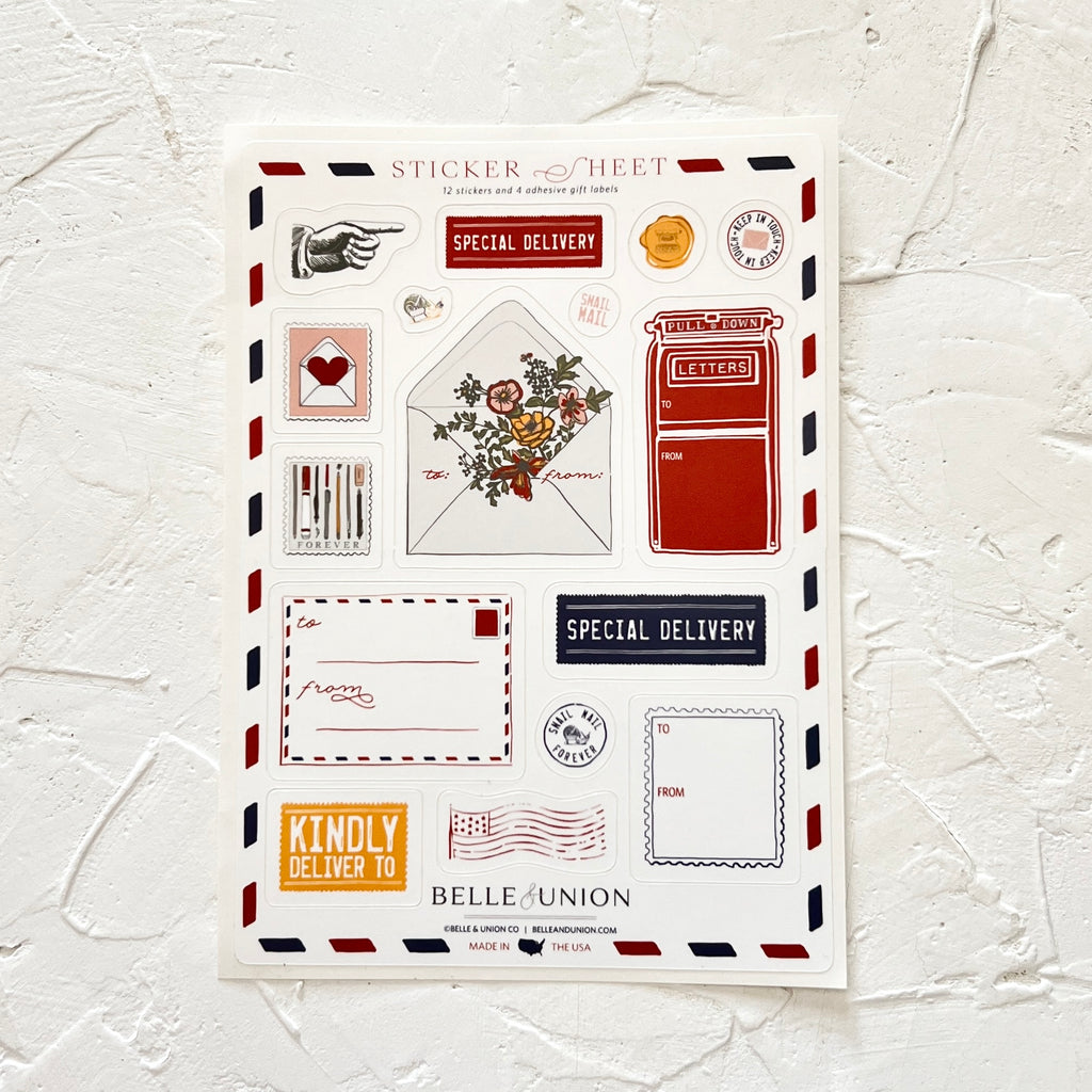 Sticker sheet with various stickers including: a gray pointed finger; special delivery; red mailbox; white mailing envelope with flowers; postage stamp; American flag; and gold seal.