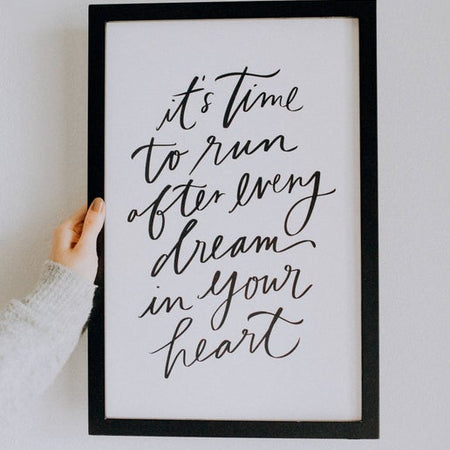Print on white background with black frame and black text saying, “It’s Time to Run After Every Dream in Your Heart”.